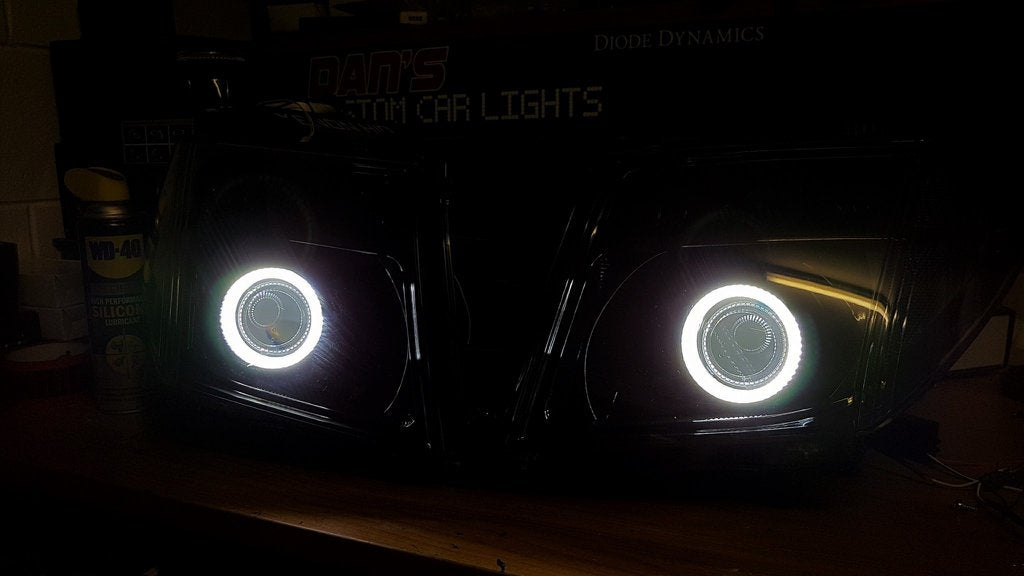 Nissan Navara D40 Thai Headlights Blacked out with Halo Rings and Projectors